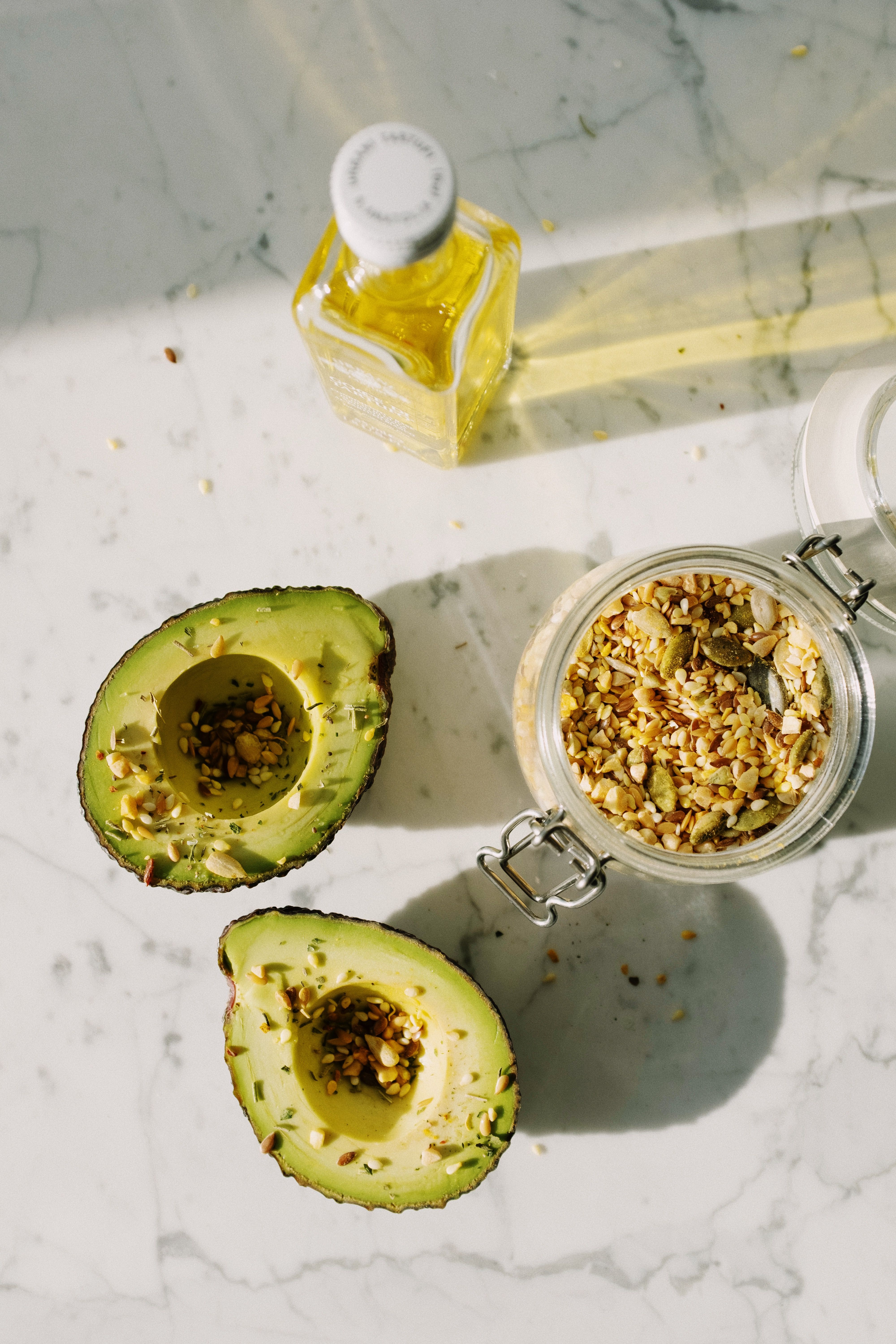 Healthy vegetarian sources of fat including avocado, nuts, seeds and olive oil